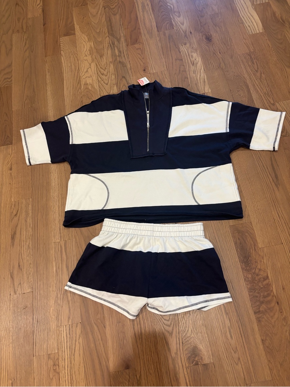 Free People Movement Women’s short sleeve “rugby” shirt and short set. Size Med